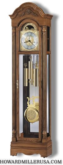 610985 Howard Miller Oak Grandfather Clock Traditional style bonnet 